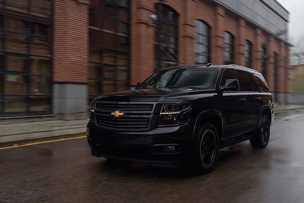 Side view of Black Chevrolet Tahoe airport shuttle